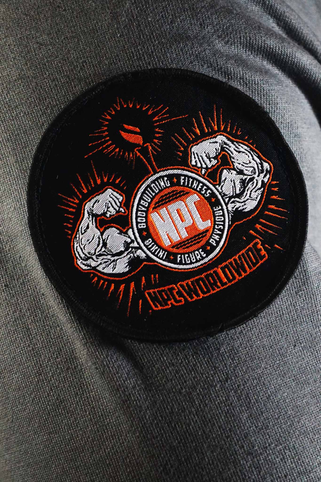 Oldschool Bodybuilding Switzerland Legacy Badges Zipped Hoodie - Grau/Orange